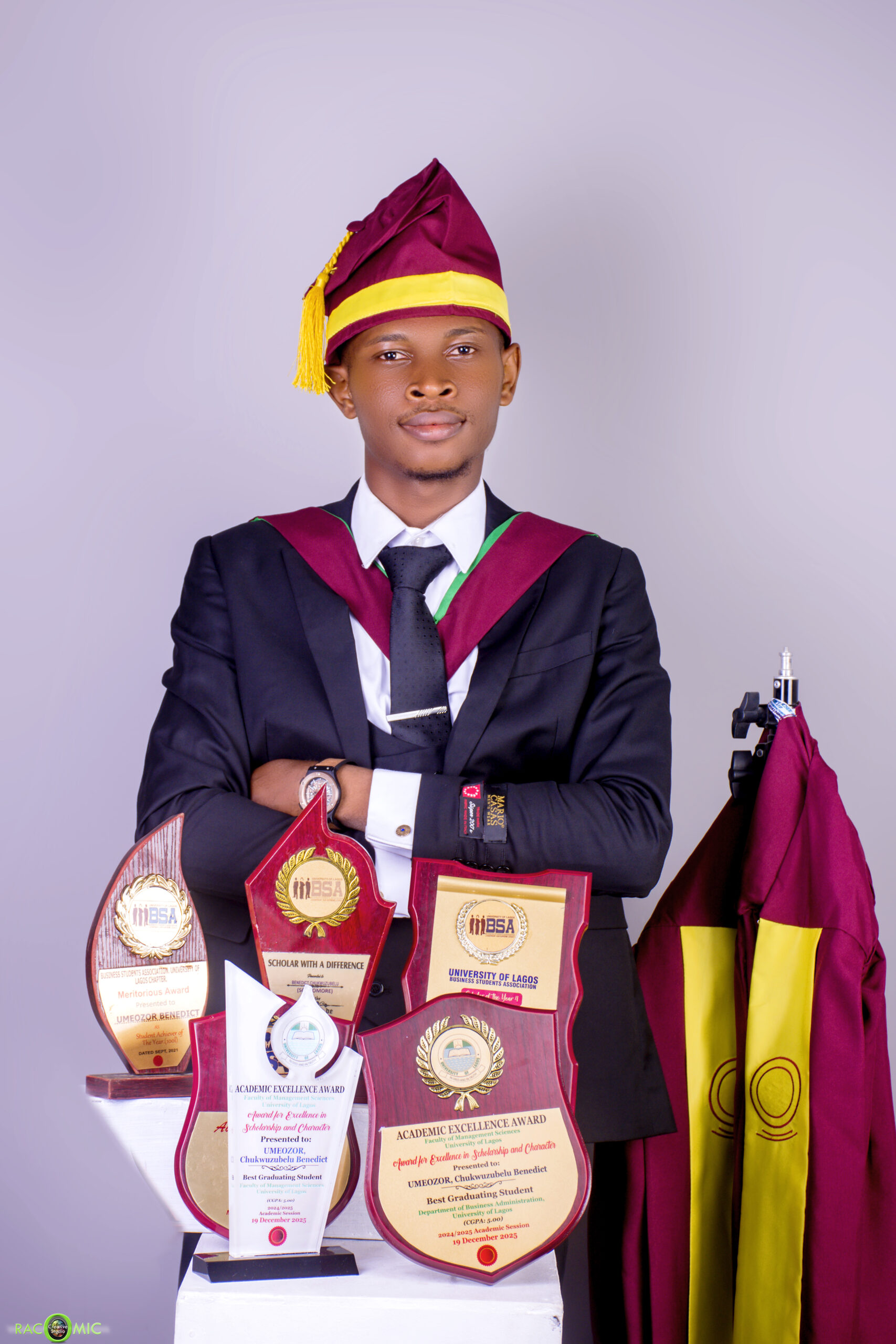 Benedict Umeozor, UNILAG’s Overall Best Graduating Student, with his academic awards and plaques for his perfect 5.00 CGPA achievement.