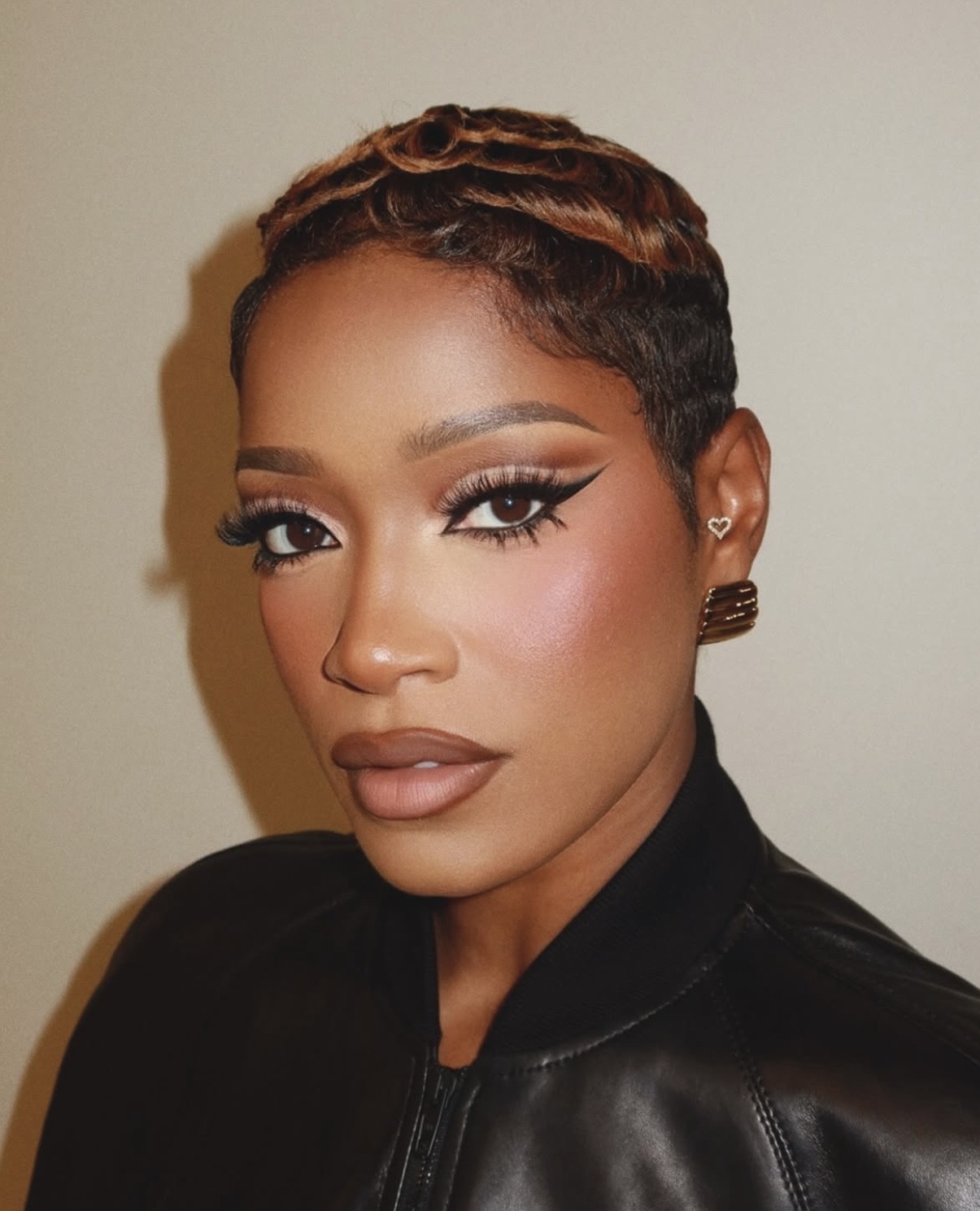 Keke Palmer's retro-inspired glam beauty with bold winged eyeliner and matte nude lips