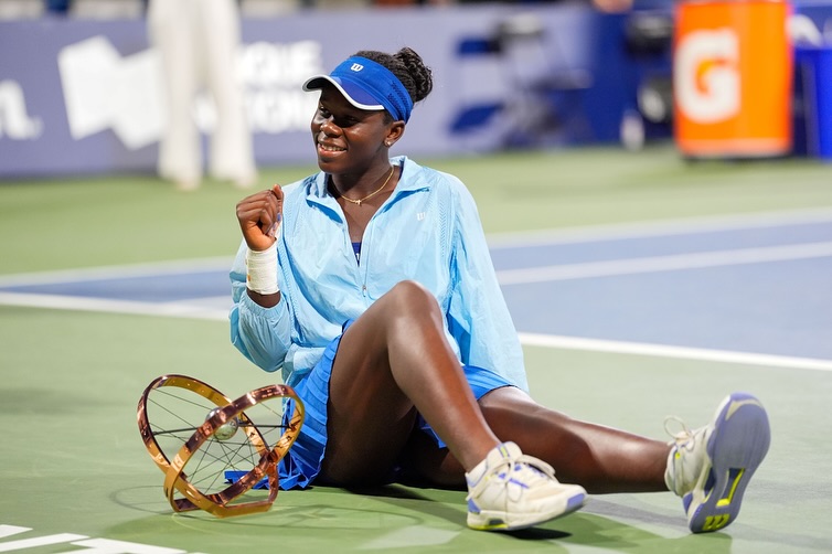 Congolese-Canadian tennis star Victoria Mboko holding her trophy after defeating Naomi Osaka to win the 2025 National Bank Open (Canadian Open) women's singles title at IGA Stadium in Montreal, Canada.