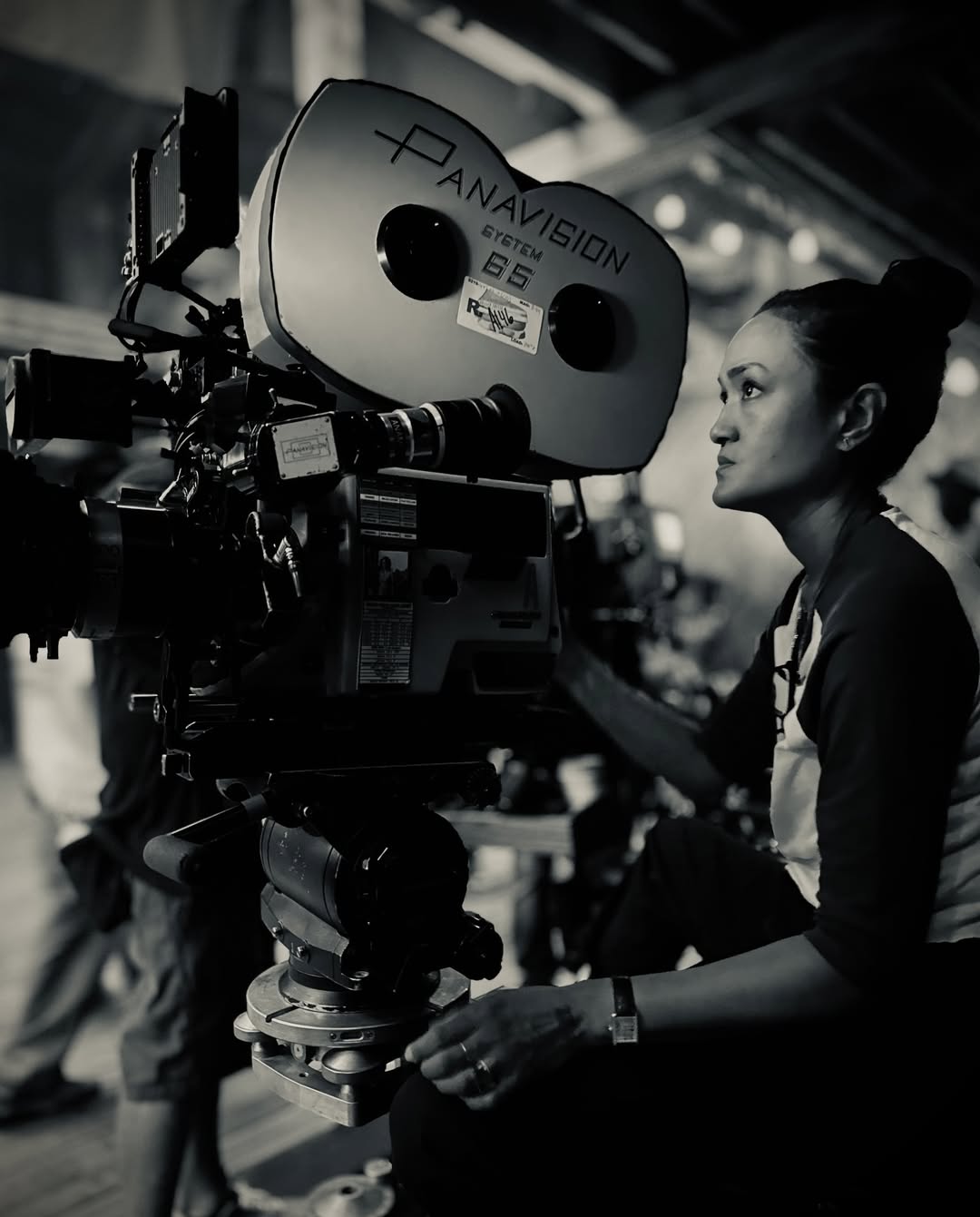 Cinematographer Autumn Durald Arkapaw operating a large-format 65mm IMAX film camera on the outdoor set of the film Sinners.