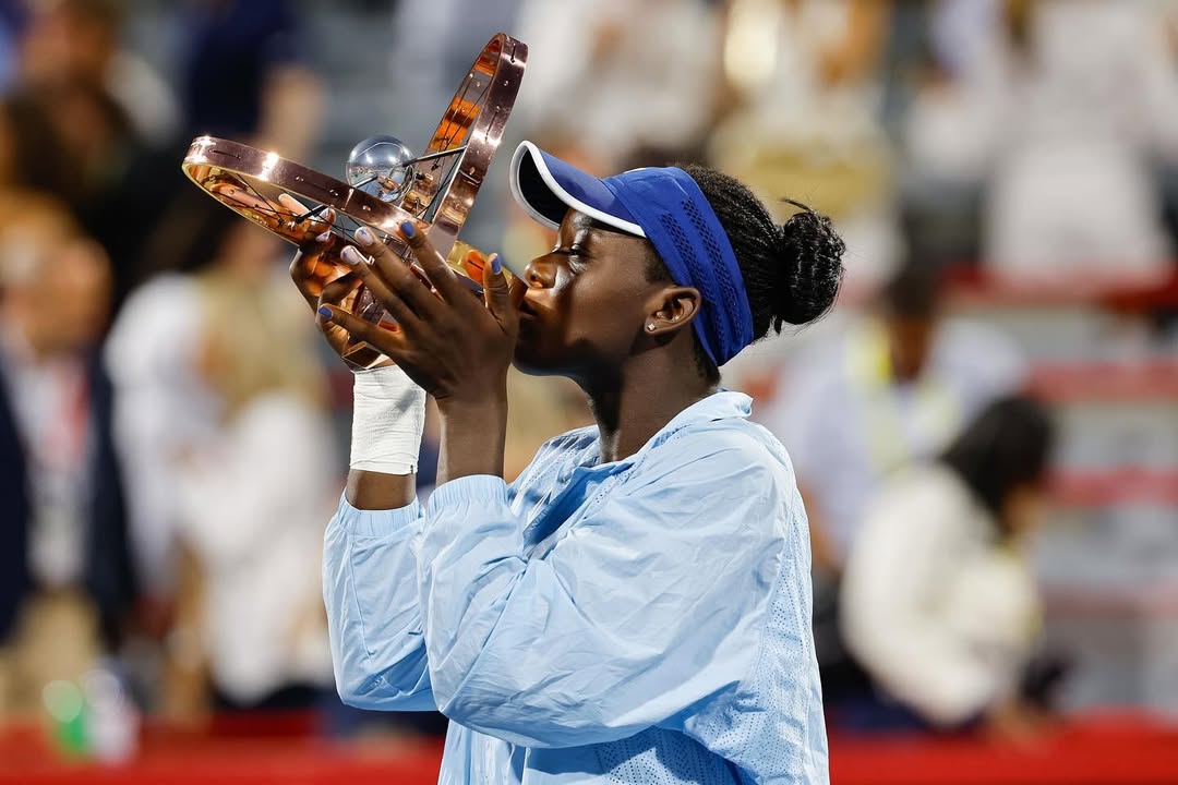 Victoria Mboko holding the National Bank Open trophy at IGA Stadium in Montreal after defeating Naomi Osaka in the 2025 final.