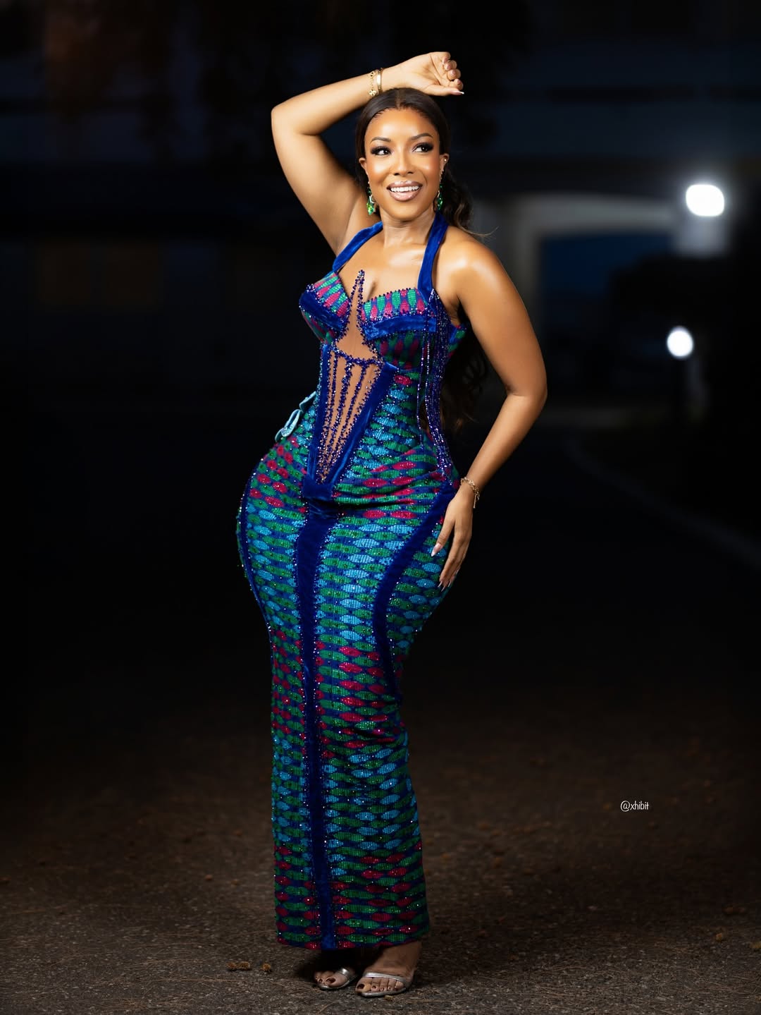 Ghanaian actress Joselyn Dumas wearing a beaded blue and red Kente floor-length dress for Ghana's 69th Independence Day.