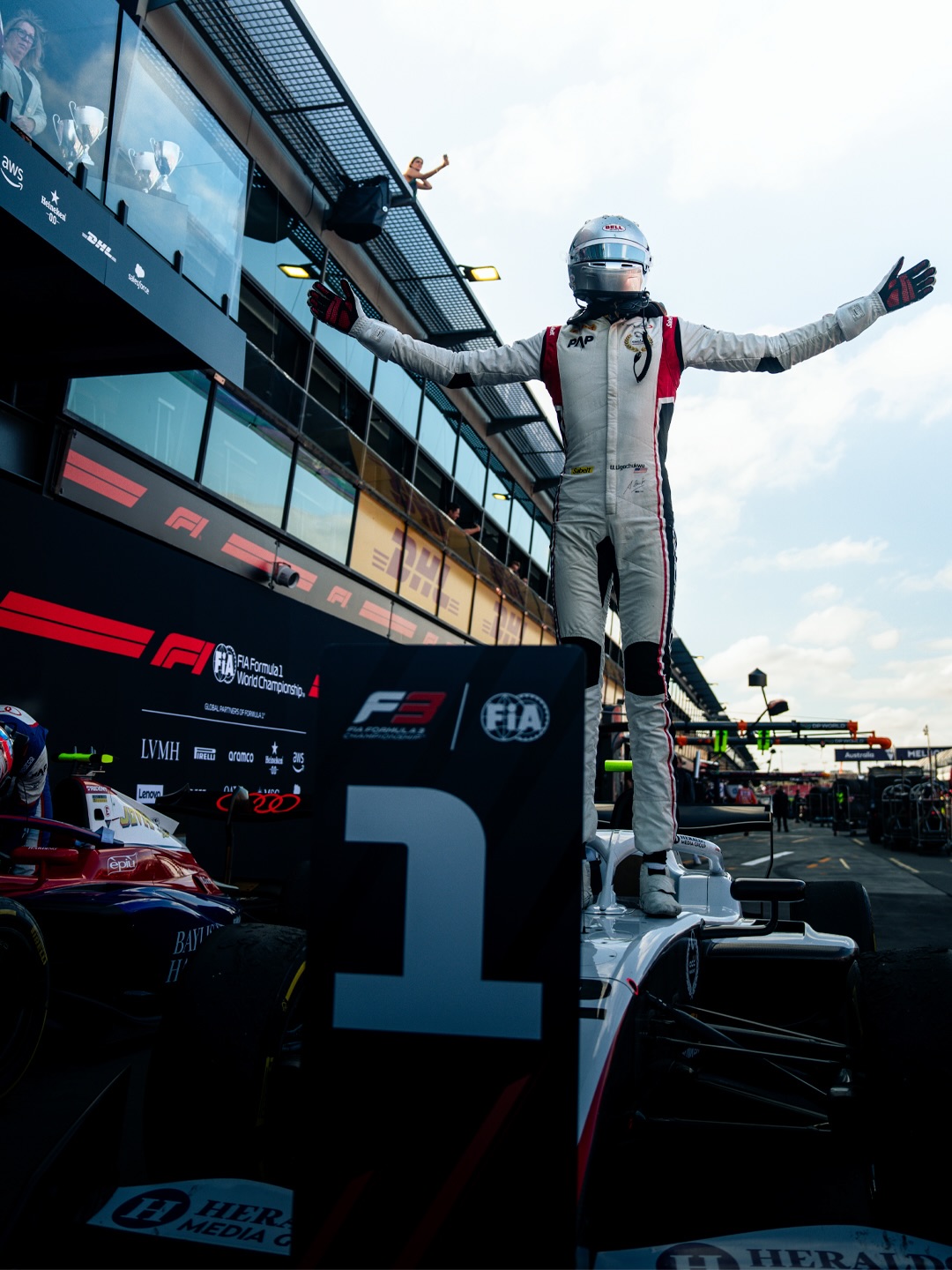 Racing driver Ugo Ugochukwu celebrating on top of his Campos Racing car after winning the 2026 FIA Formula 3 season-opening Feature Race in Melbourne.