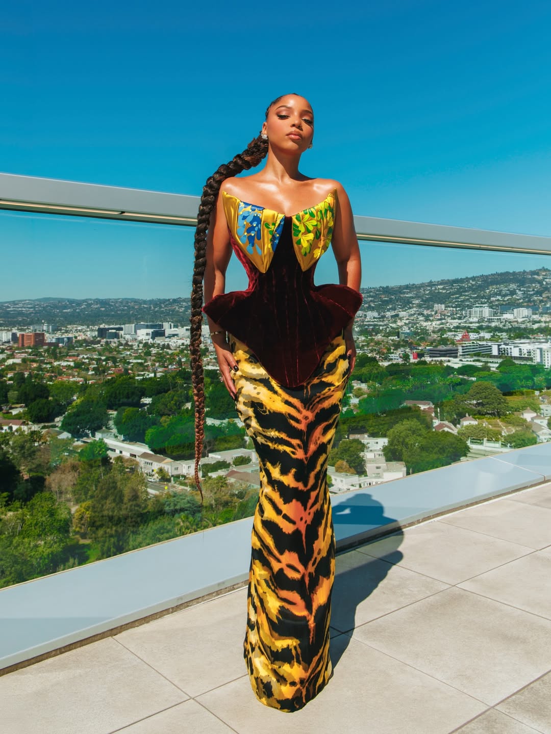 Chloe Bailey in a burgundy velvet and tiger-print corset gown by Harris Reed.