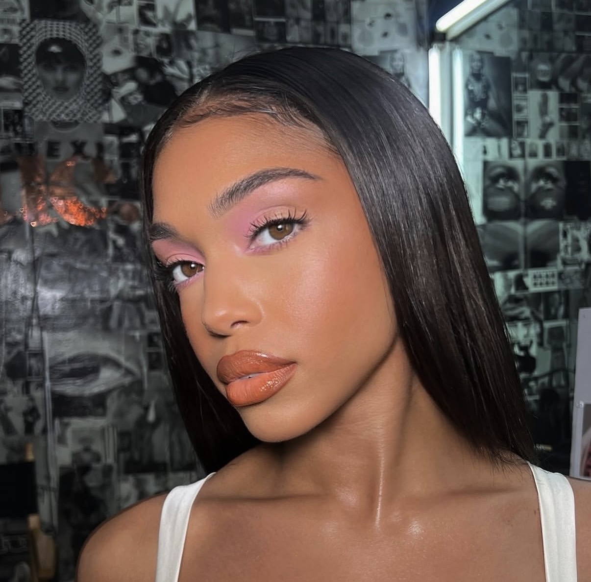 Soft glam pastel makeup look with bronzed skin and pink eyeshadow