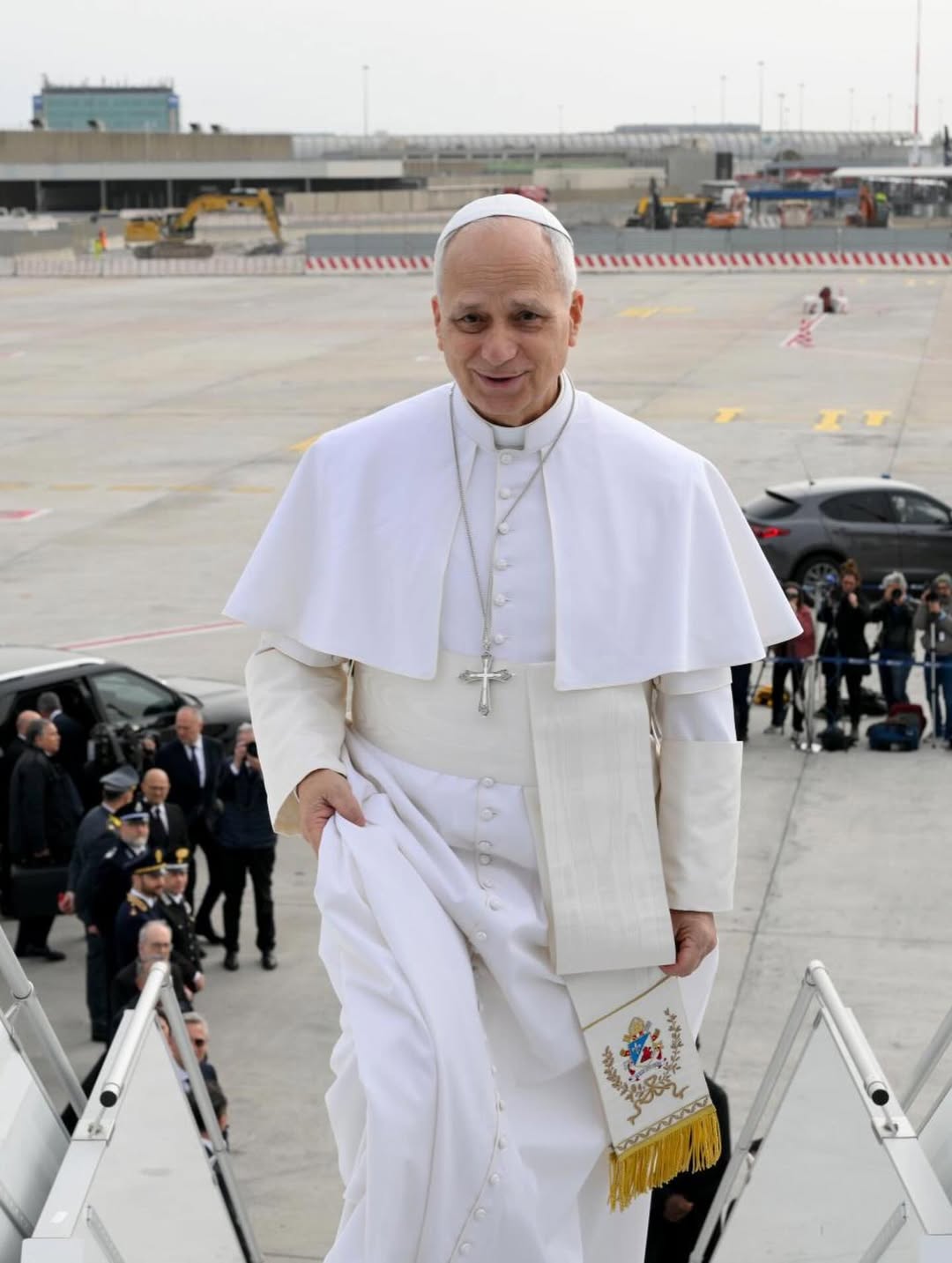 Pope Leo XIV boarding the papal plane at Fiumicino International Airport in Rome for his historic first visit to Africa.
