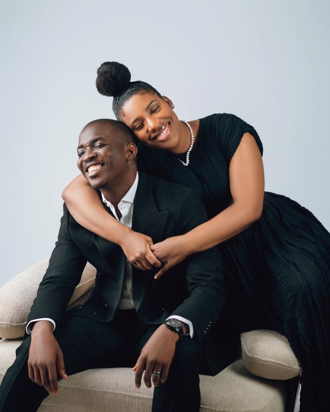 Minister Theophilus Sunday and wife Ashlee Sunday smiling in a professional portrait celebrating their second wedding anniversary.