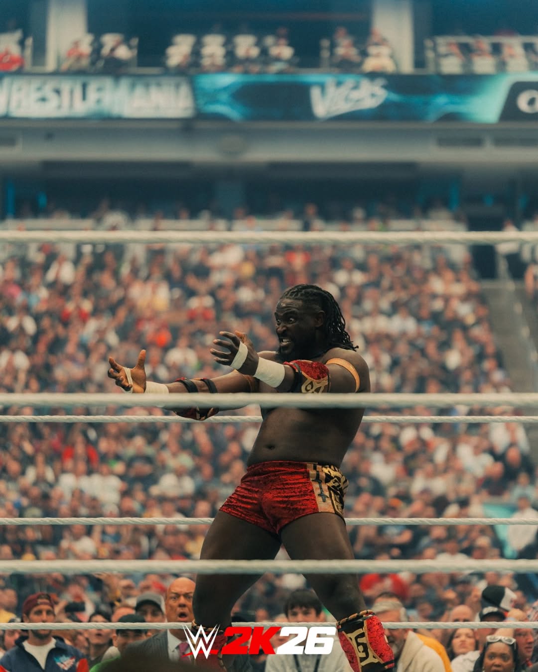 Oba Femi gesturing to the crowd from inside the ring at Allegiant Stadium during his WrestleMania 42 match against Brock Lesnar.