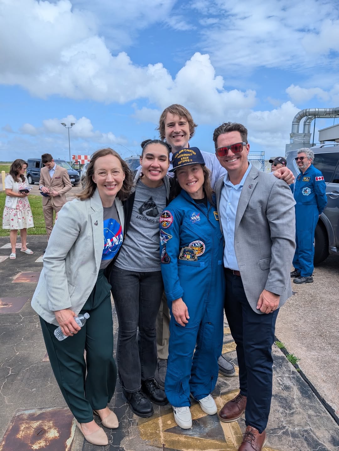NASA astronaut Christina Koch celebrating with members of the Johnson Space Center recovery team after the Artemis II mission.