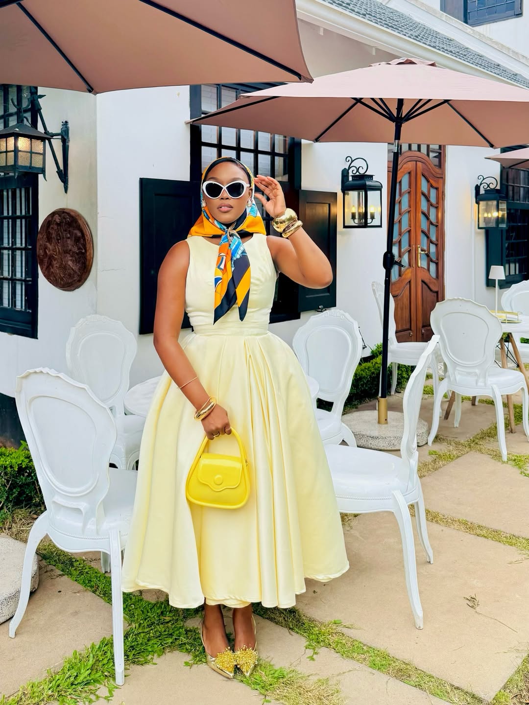woman wearing yellow understated easter outfit dress with scarf