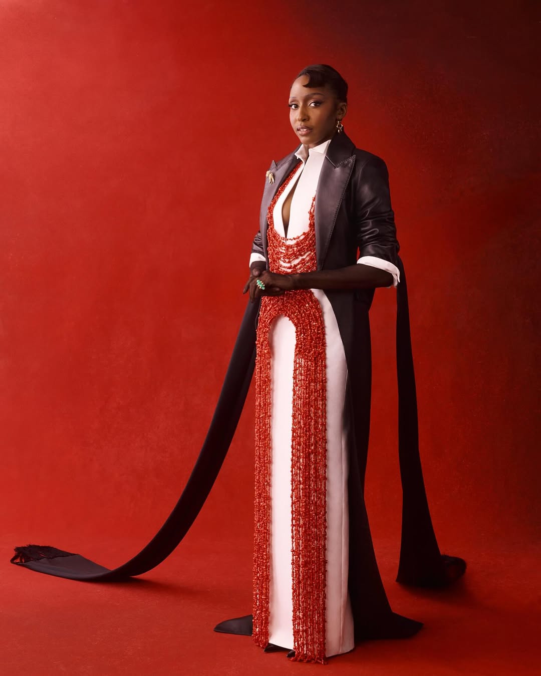 Ayo Edebiri in a Ferragamo look by Maximilian Davis featuring traditional Edo coral beads for the 2025 Met Gala "Superfine" theme