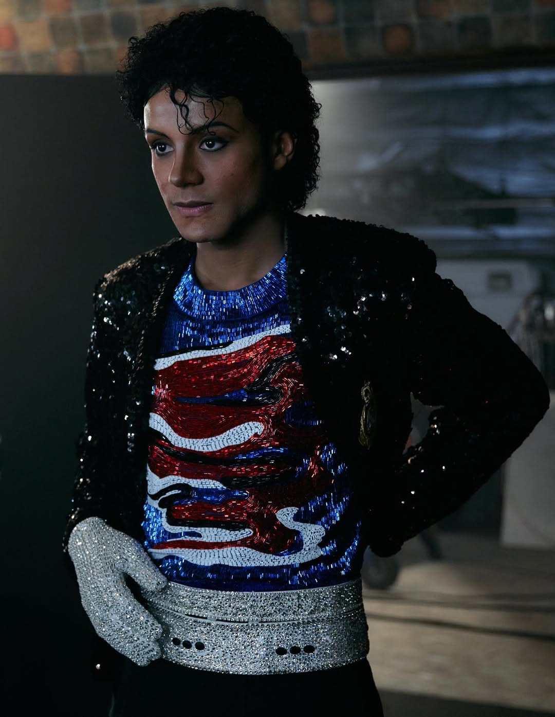 Jaafar Jackson on the set of the 2026 "Michael" biopic, wearing a recreated beaded patriotic top and sequined jacket.