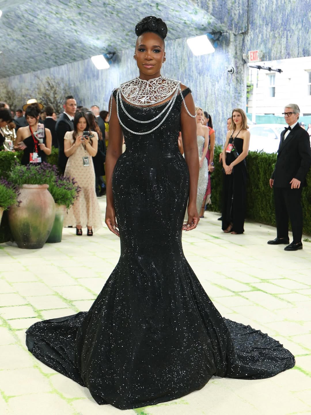 Venus Williams in a black sequin mermaid gown with a Swarovski silver crystal neckpiece at the 2026 Met Gala red carpet