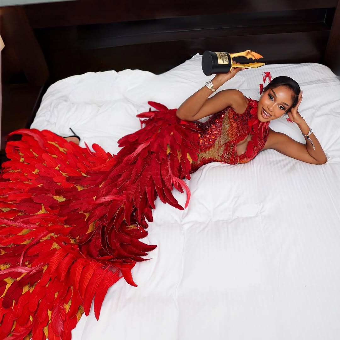 Uche Montana smiling in her custom Tubo gown, styled by Dahmola for the 2026 Africa Magic Viewers’ Choice Awards.