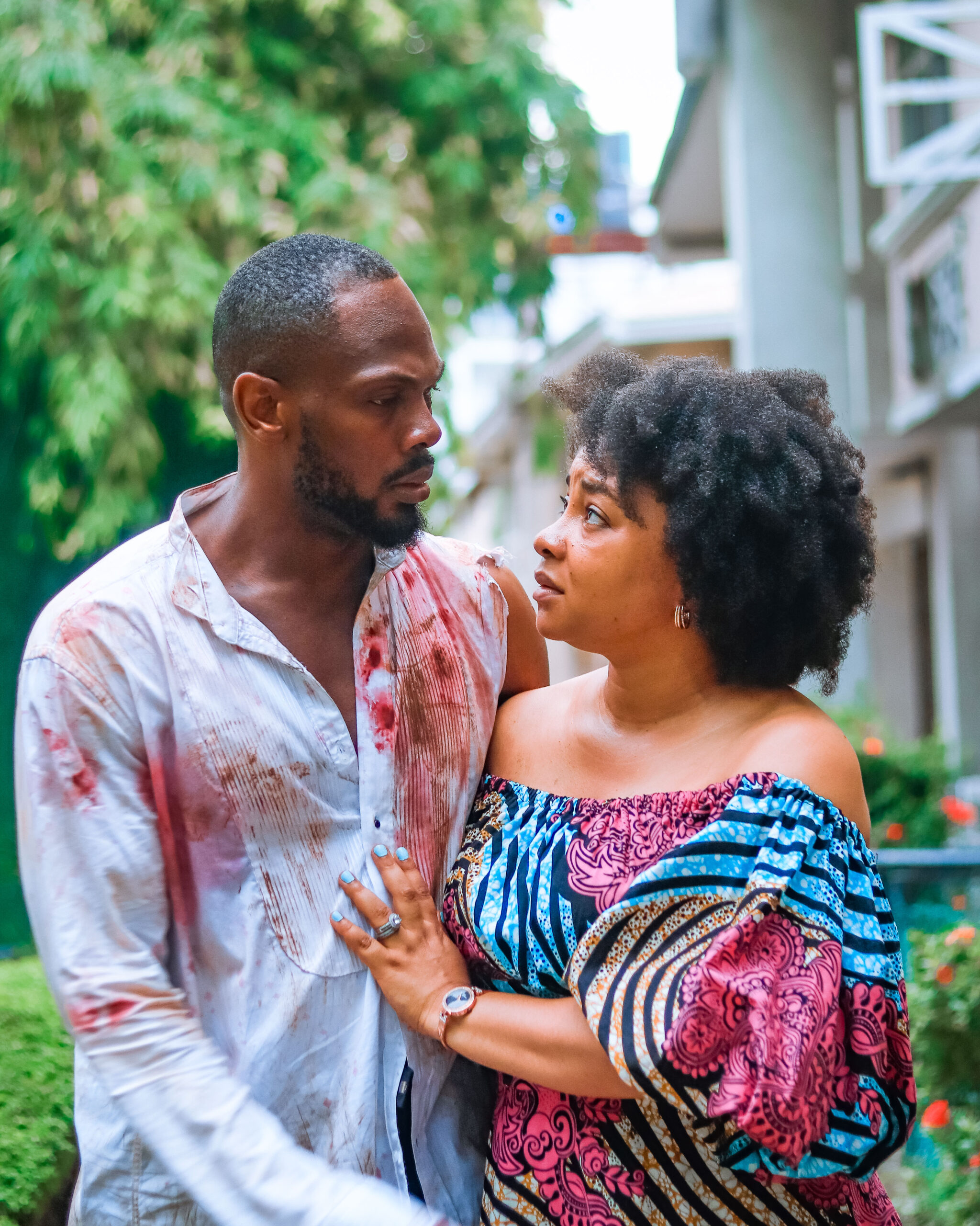 Linda Ejiofor-Suleiman and Daniel Etim Effiong in a dramatic scene from The Herd, featuring a blood-stained shirt.