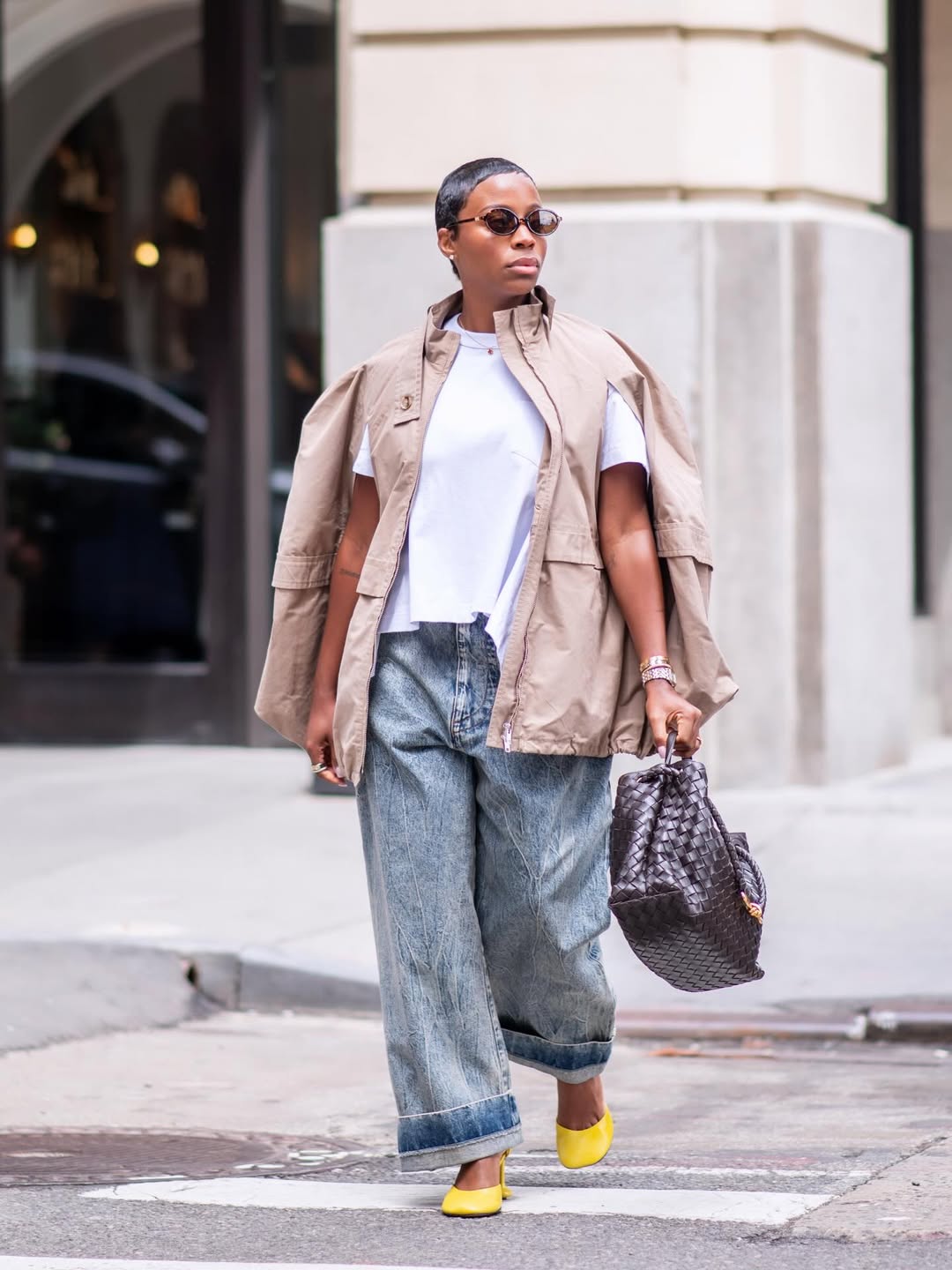 woman wearing a lightweight nude jacket in spring with jeans