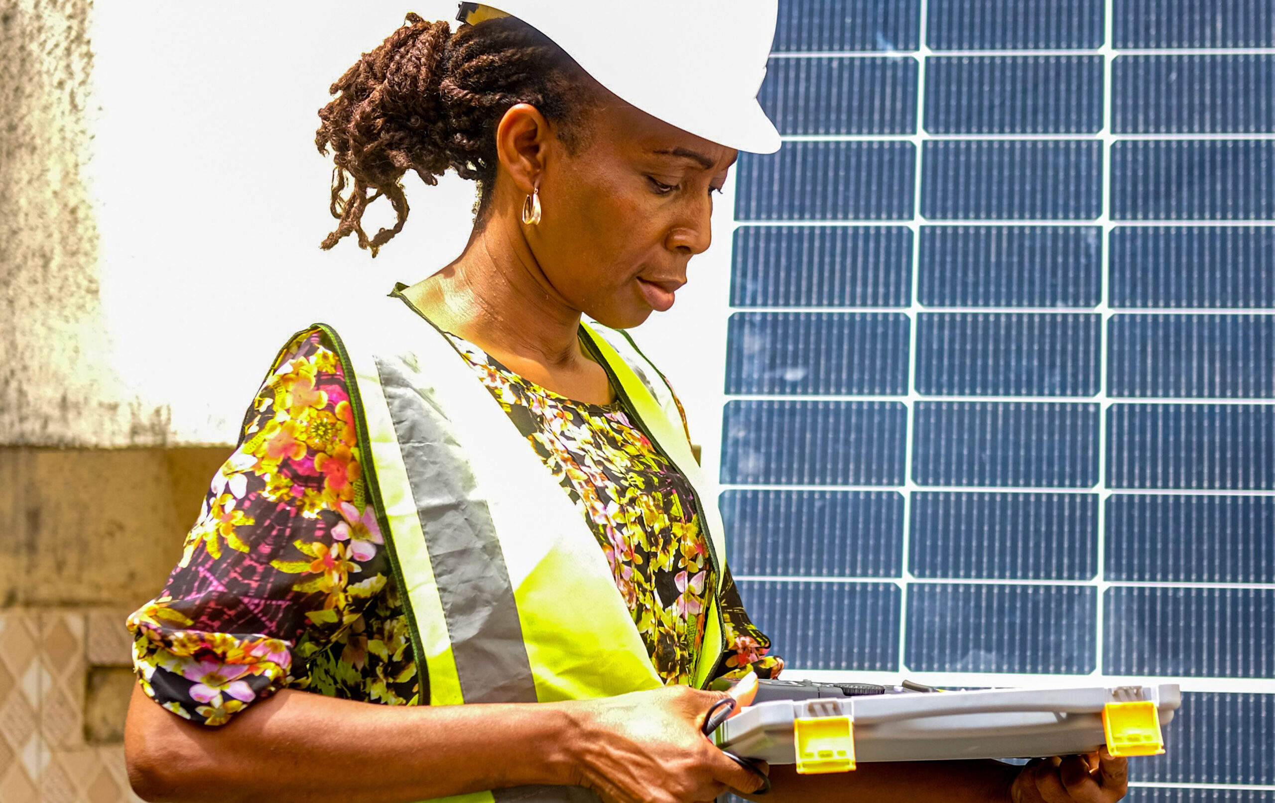 Nkechi Okenwa, CEO of Energy Excell Systems and Solutions, checking solar panel accessories in her store at CITEC Estate by Jabi-Airport Road bypass, FCT Abuja, Nigeria on April, 1, 2026. Photo: Jerry Ogbe, bird story agency
