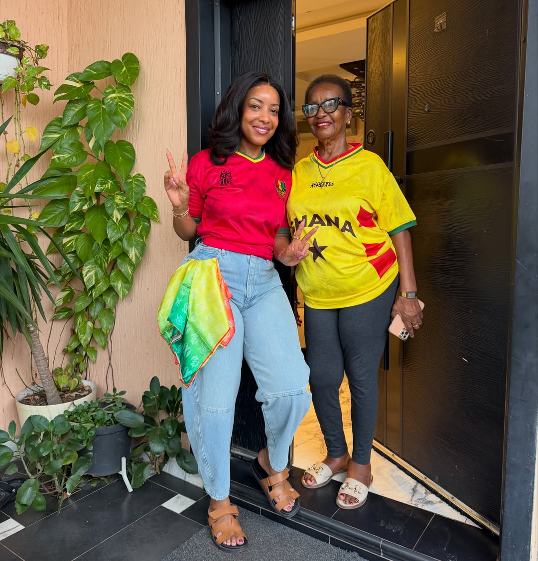 Joselyn Dumas and her mother, Bridget Mateko Dumas, smiling and flashing peace signs while dressed in matching team gear for the Ghana vs Panama 2026 FIFA World Cup match.