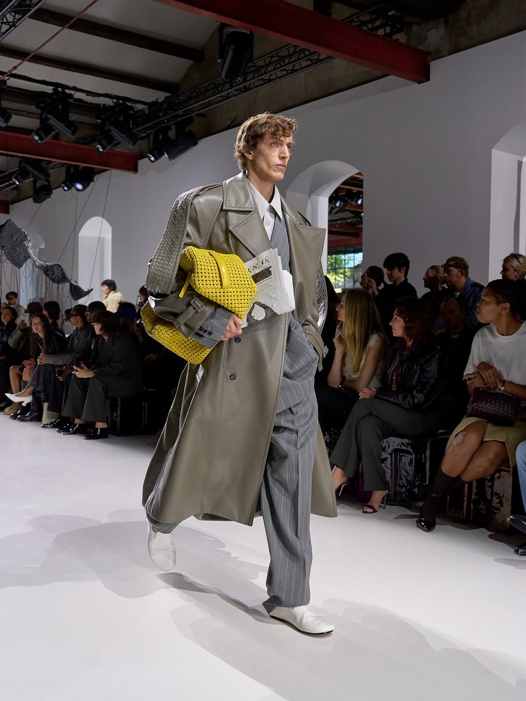 man walking the runway for bottega veneta
