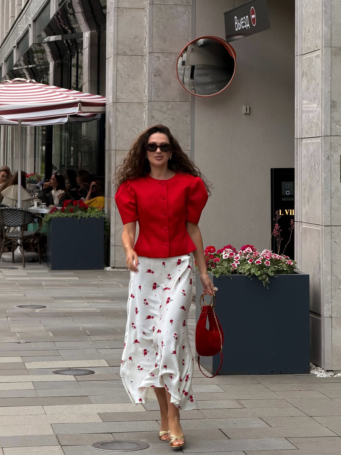 woman wearing red blouse and red and white skirt signature style