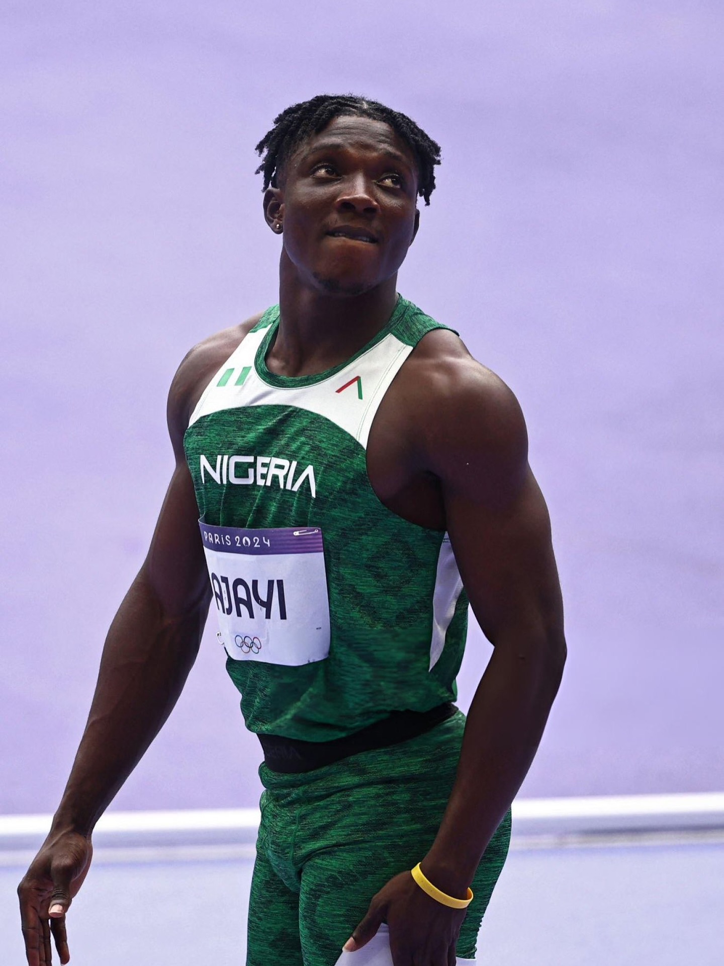 Kanyinsola Ajayi competing for Team Nigeria in green athletics kit at the World Athletics Championships in Tokyo after running 9.88 seconds.