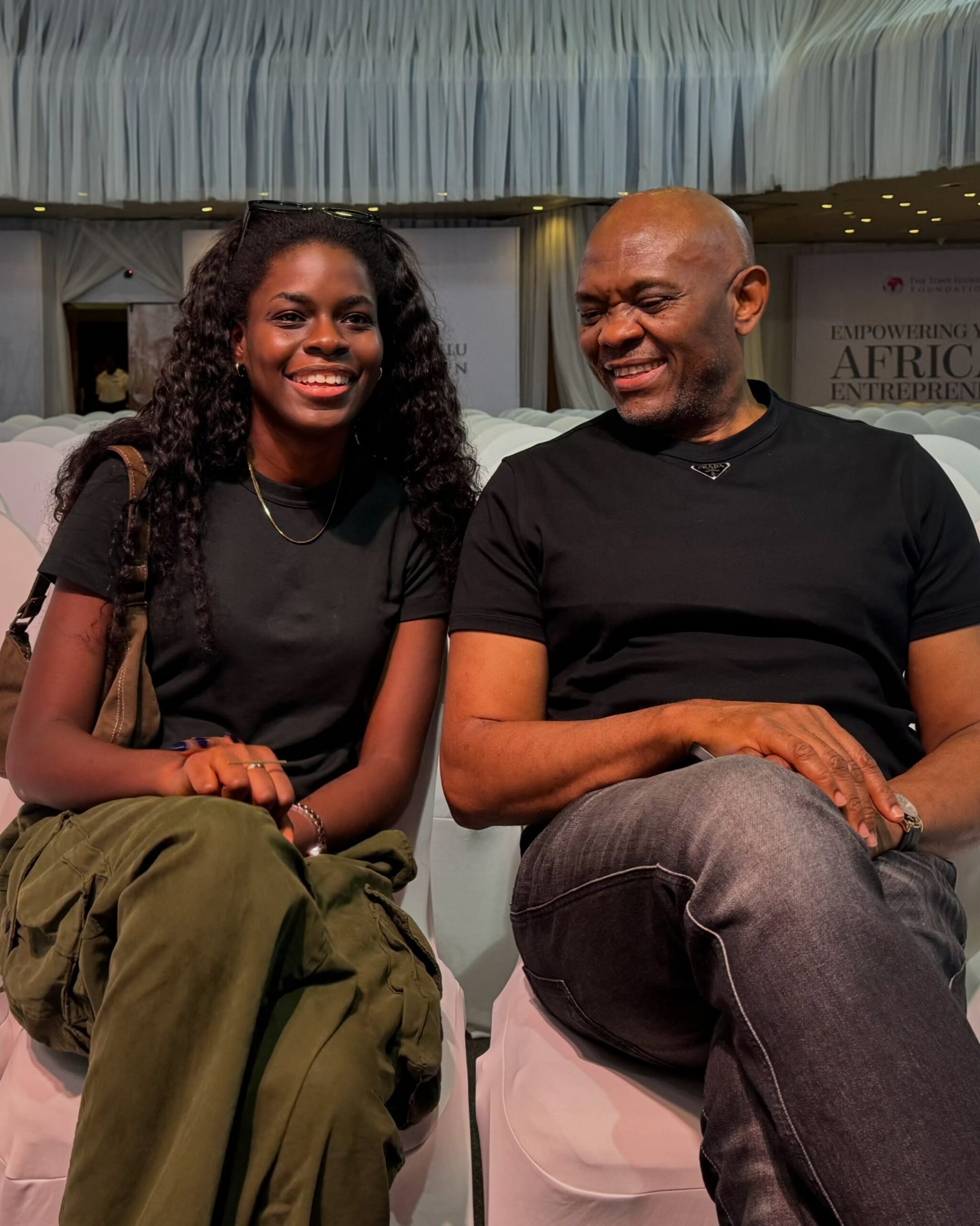 Billionaire Tony Elumelu and YouTube creator Korty EO smiling together at the Tony Elumelu Foundation event in Abuja, Nigeria.