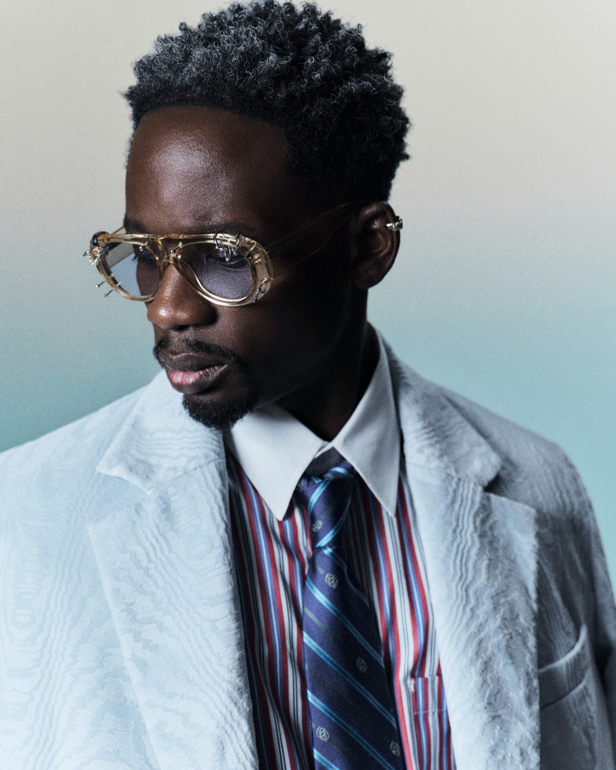 Mr Eazi posing for the official promotional campaign of his dancehall single Lambo featuring Jamaican artist Vybz Kartel.