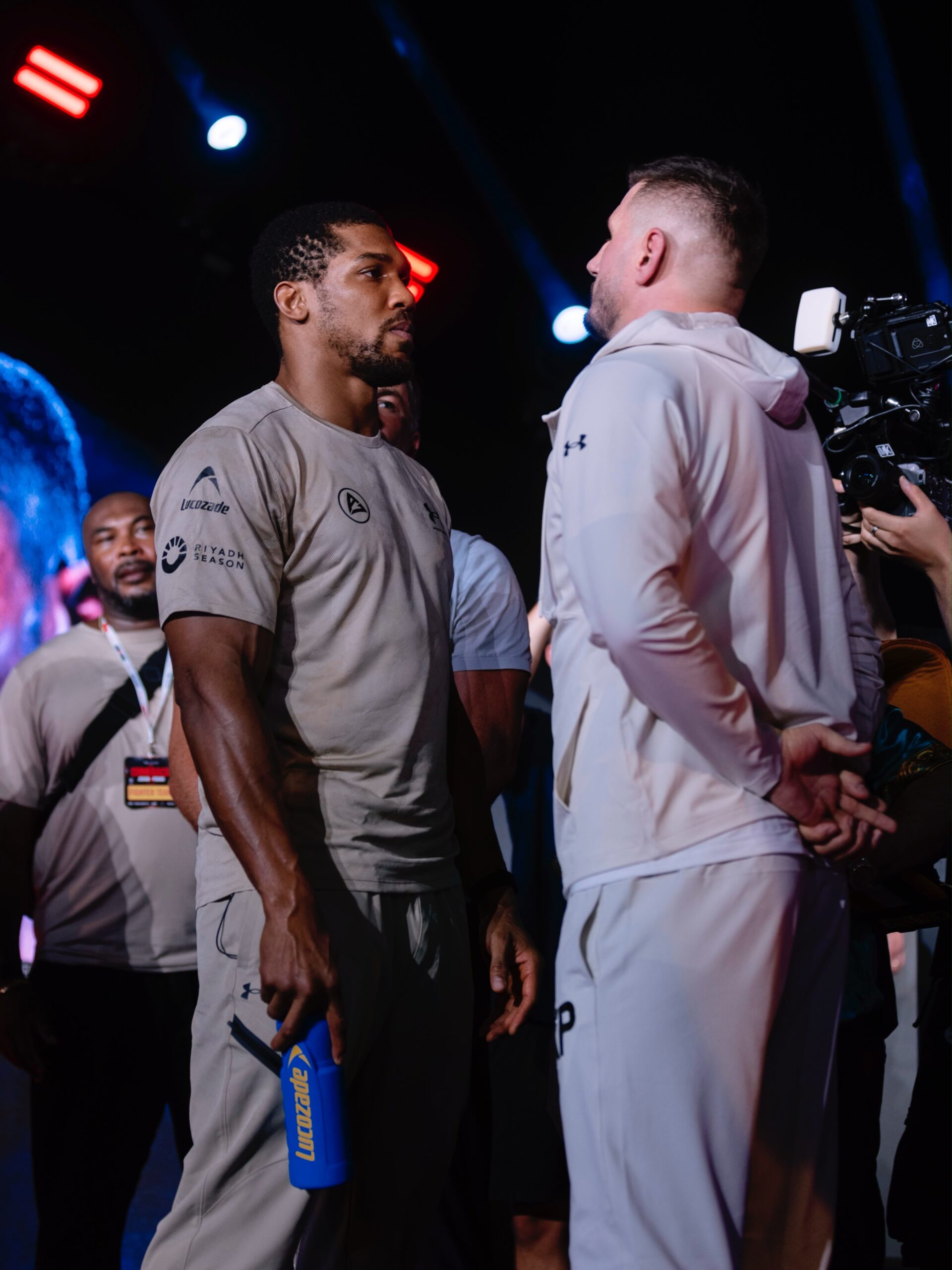 Heavyweight boxers Anthony Joshua and Kristian Prenga engaging in a tense pre-match face-off prior to their fight at the Jeddah Superdome.
