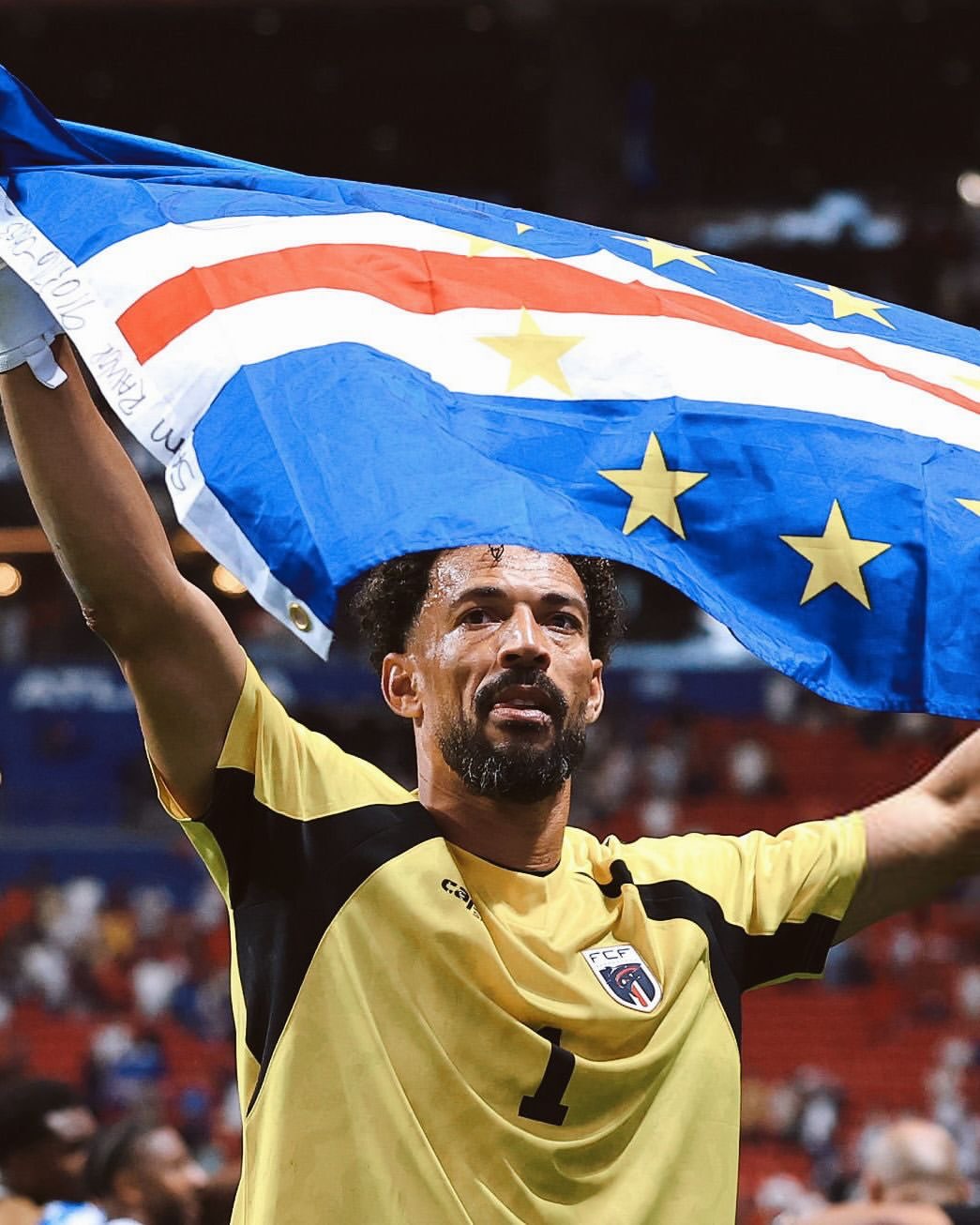 Vozinha raises the Cape Verdean flag after a match. Photo credit: Vozinha/Instagram