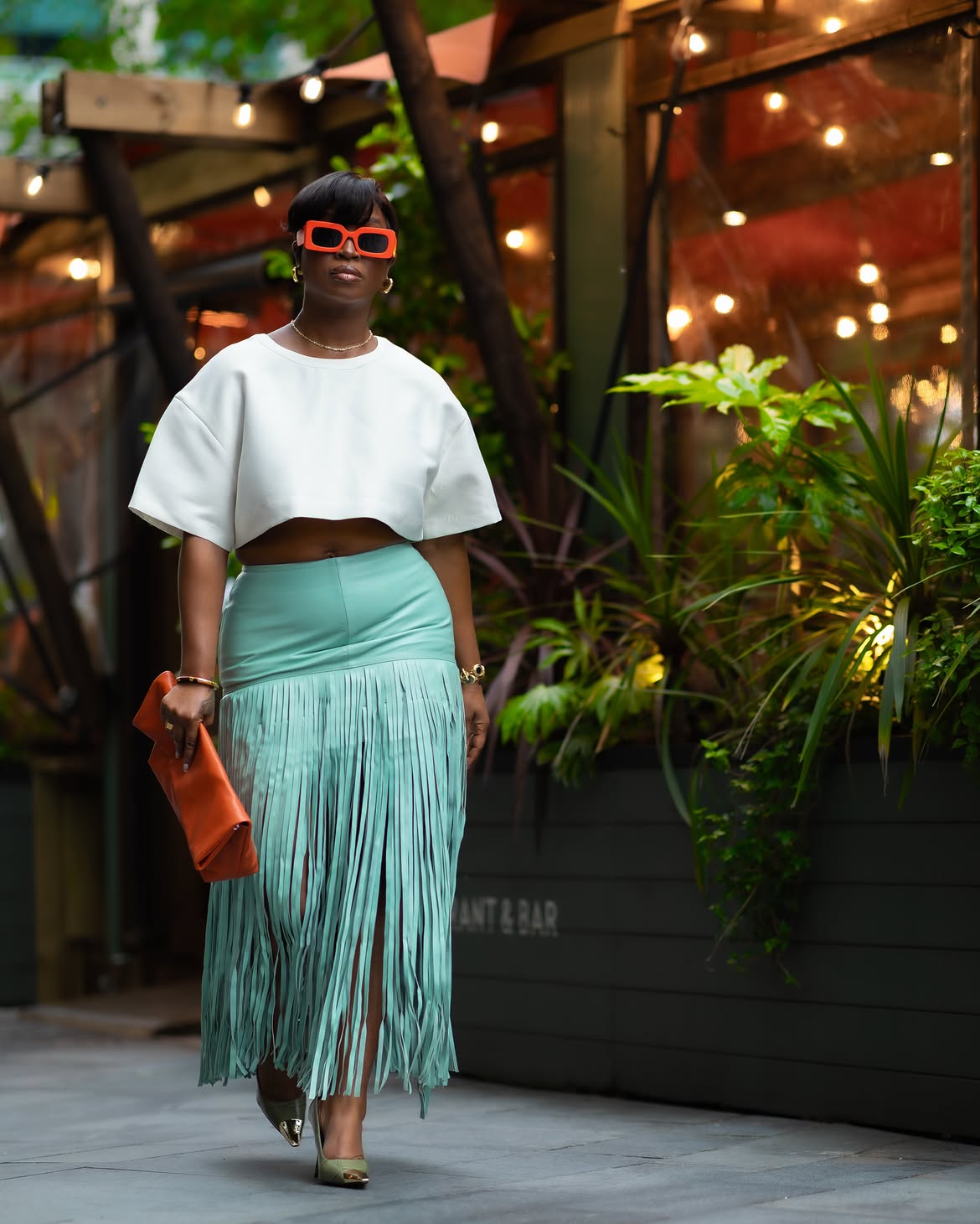 woman wearing orange accessories with summer fashion