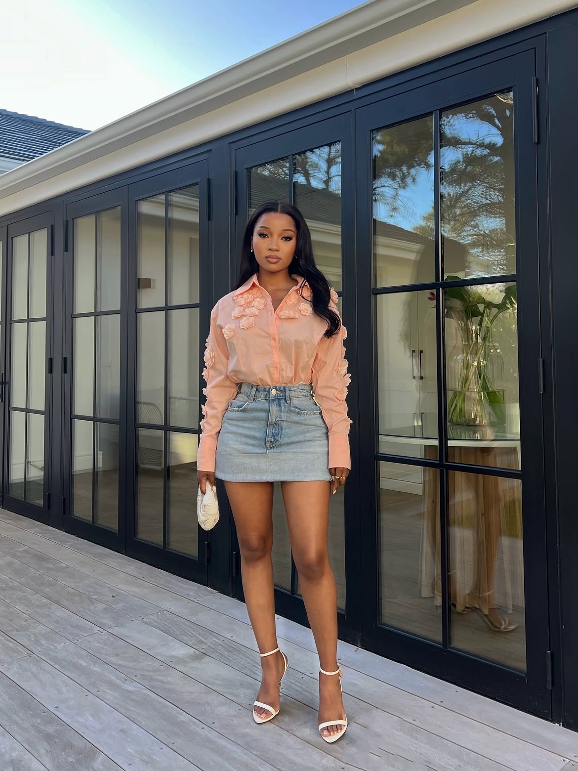woman wearing orange shirt and denim skirt fashion for summer